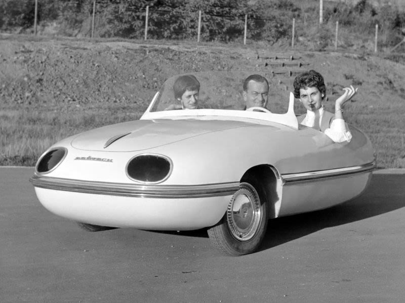 That’s Egon in the middle with his ever present secretary on his left, and some lady he seems less impressed with. This car was called the Spatz, or sparrow.