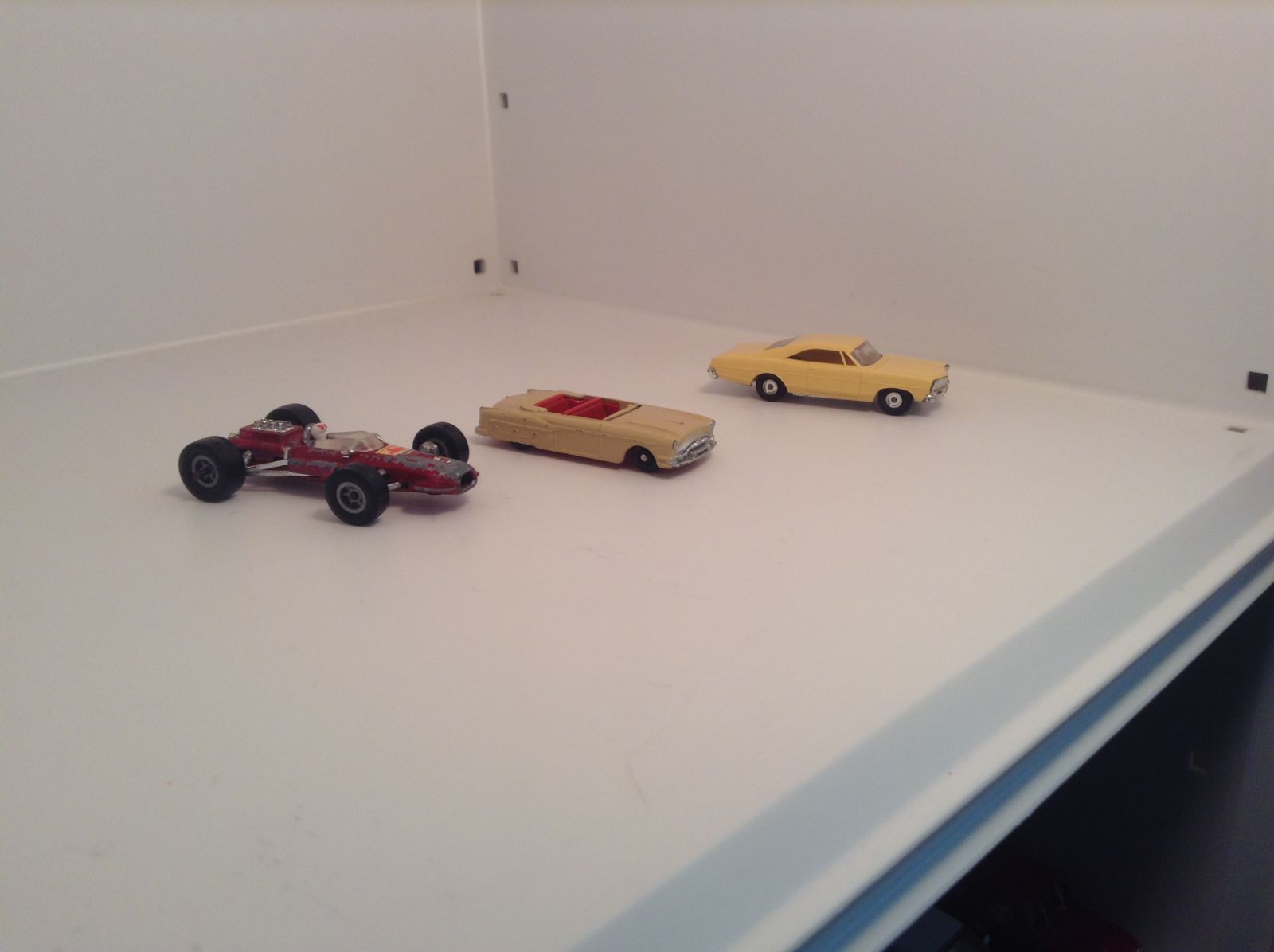 Majorette Ferrari, Budgie Packard (missing windscreen), and Cigar Box Ford Galaxie (needs screws)