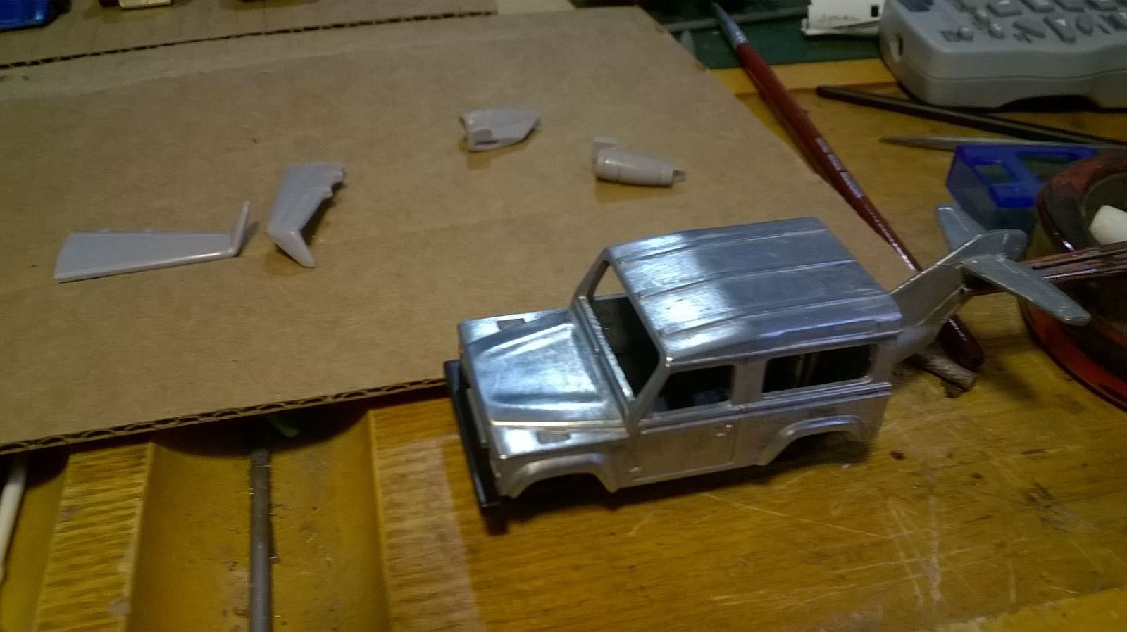 The engines fit perfectly between the rear fenders and the doors. It should look pretty interesting when finished.