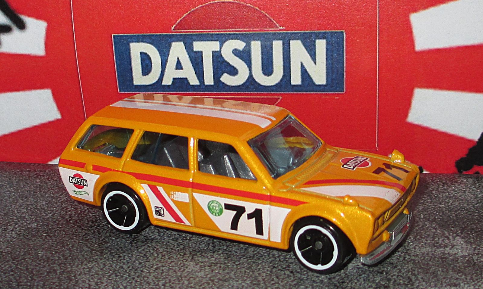 Illustration for article titled Land of the Rising Sun-Day - Hot Wheels Yellow Datsun 510 Wagon