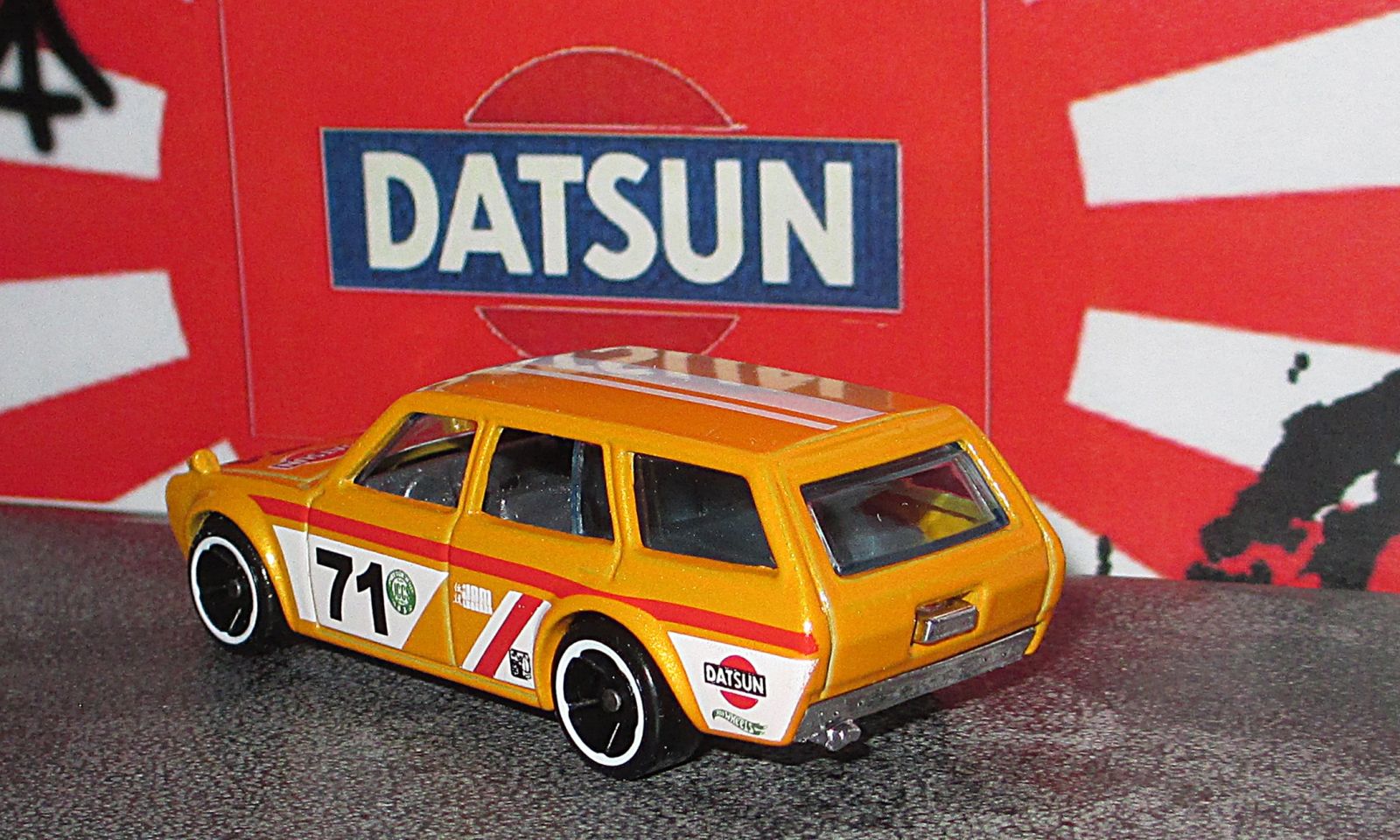 Illustration for article titled Land of the Rising Sun-Day - Hot Wheels Yellow Datsun 510 Wagon