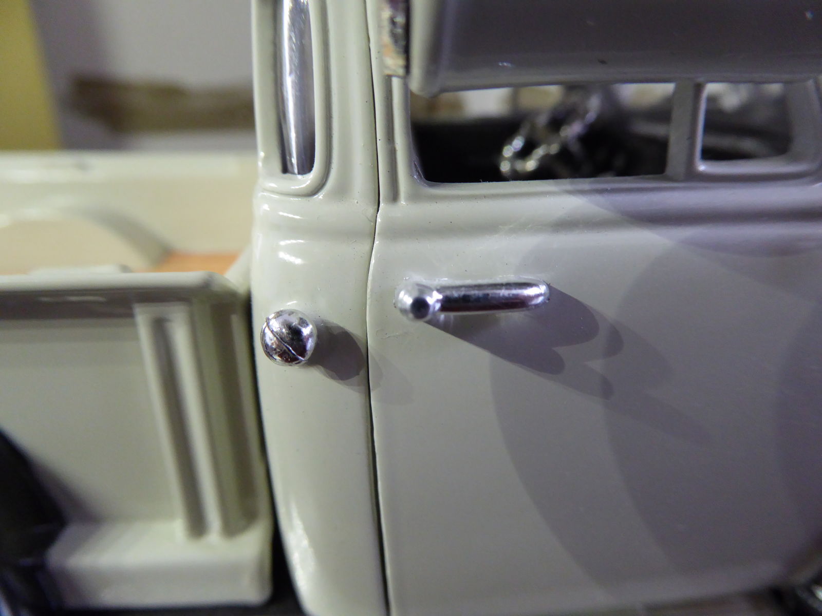 Gas cap and door handles are separate parts. No gap on the door when pictured in close up.