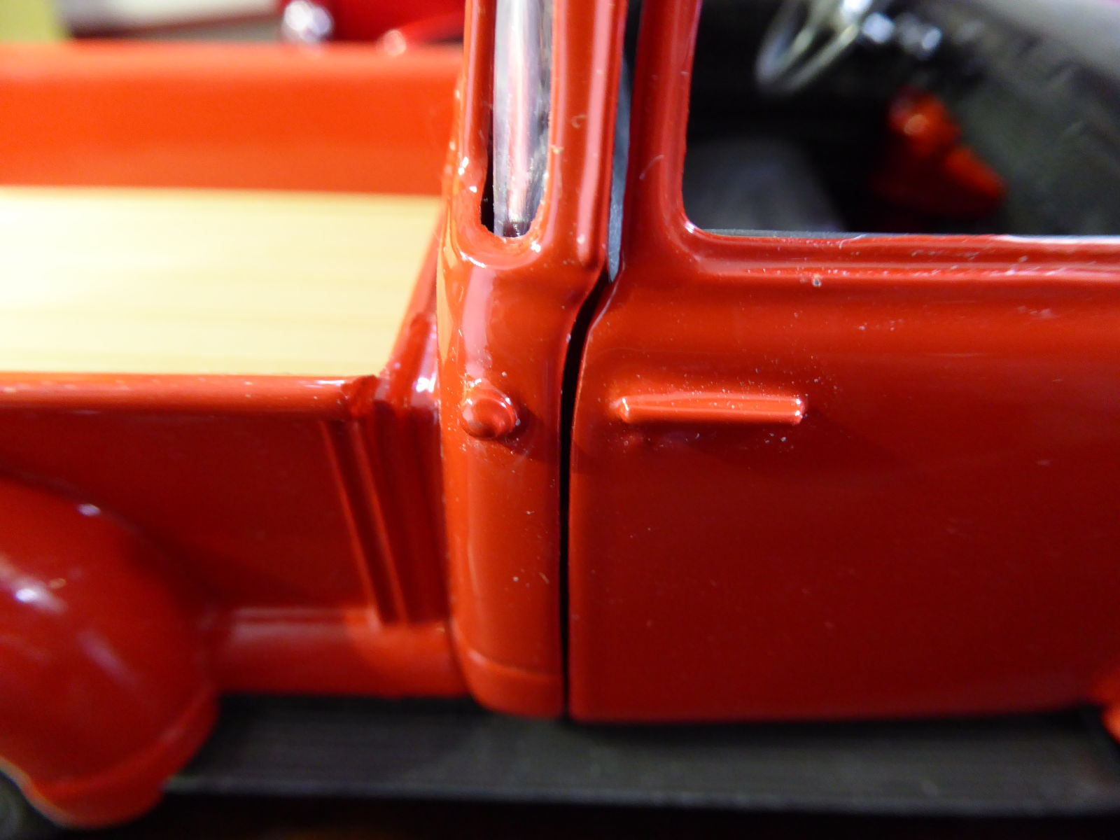 Gas cap and door handles are molded with the body and painted with the same color. A gap on the door when pictured in close up but looks ok when viewed from a distance.