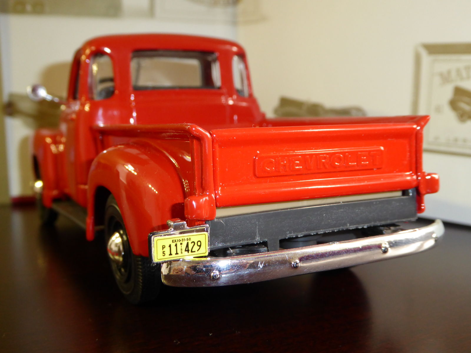 The license plate holder is molded with the bumper. Rear lights are molded with the body and painted with the same color.