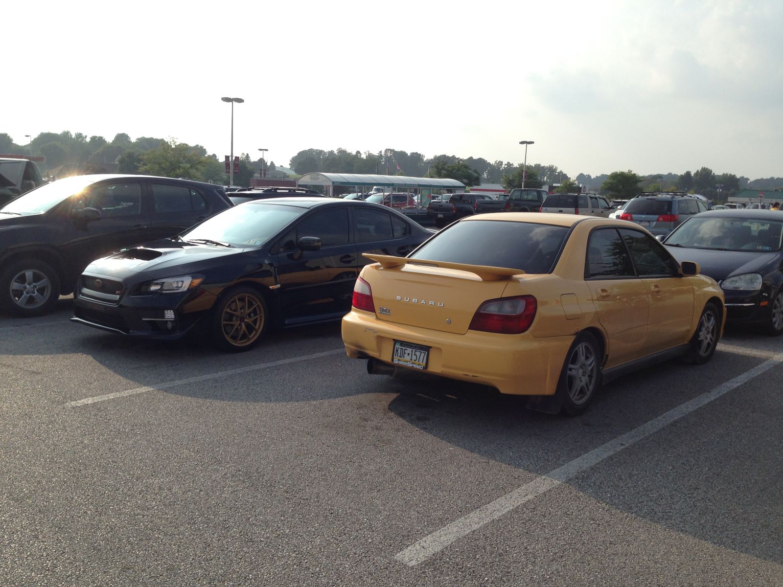Illustration for article titled 2003 Sonic Yellow WRX (and a Bonus STi)