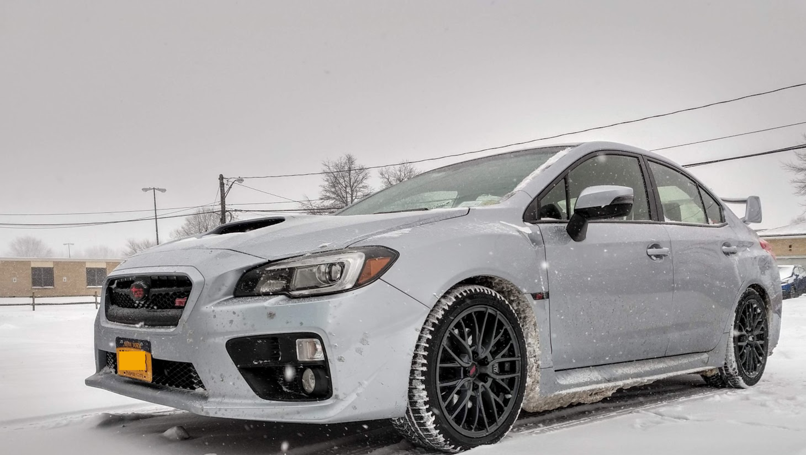 My STI with a good view of the snow-packed Nokian WR-G4 tires.
