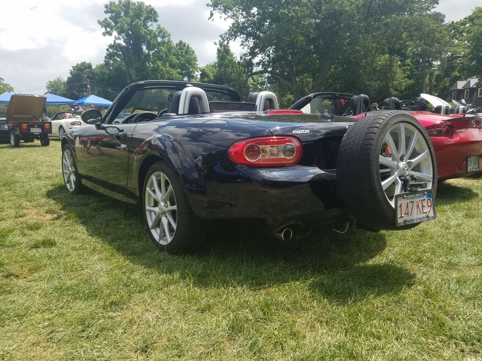 Apparently this is a relatively common Miata mod? There were a few like this. You have to wonder... is the rear end a pendulum now and what does that do to the handling?