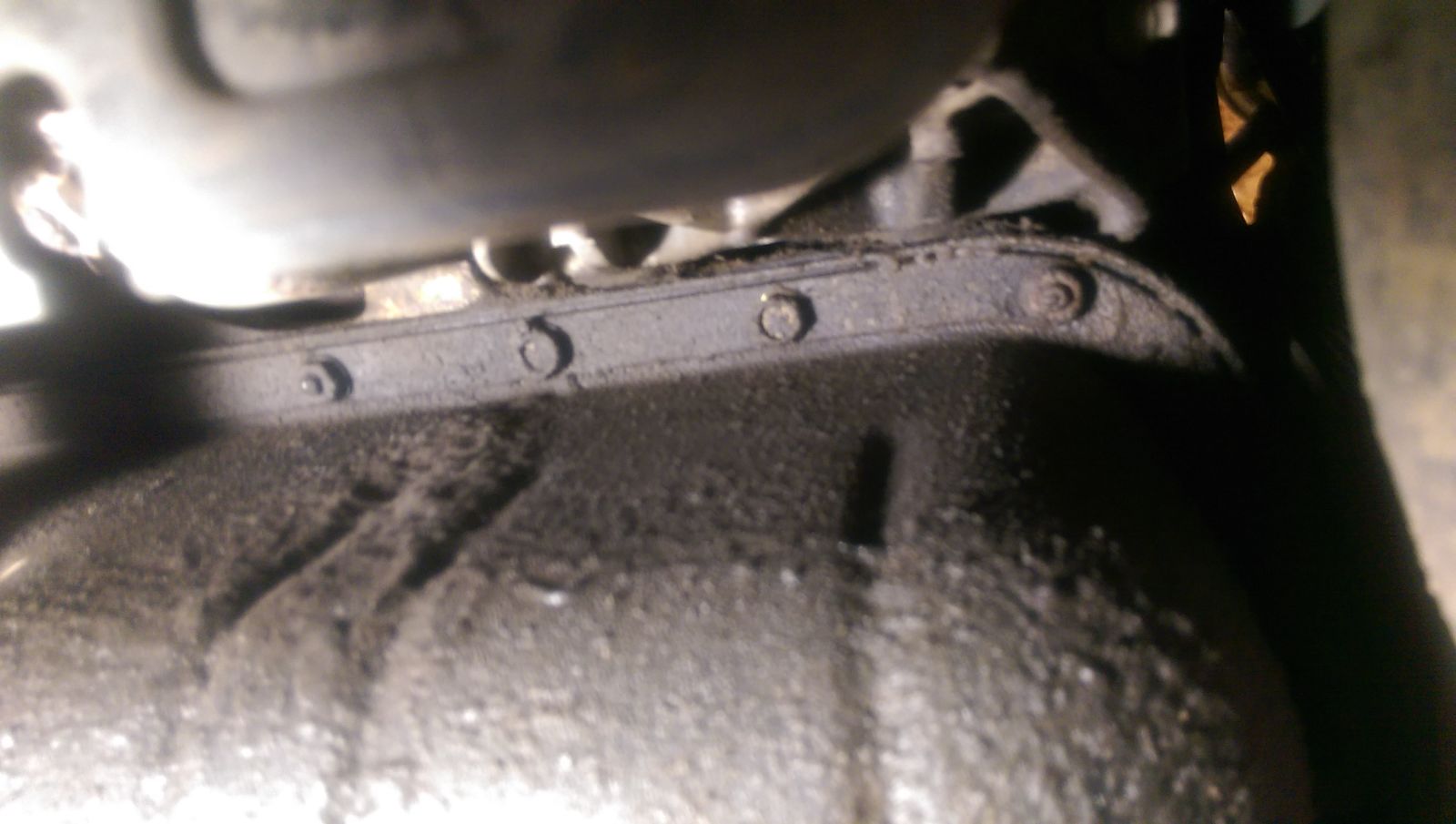 Along the front and driver’s side of the pan, the bolts are easily accessible. Some definitely visible seepage here.