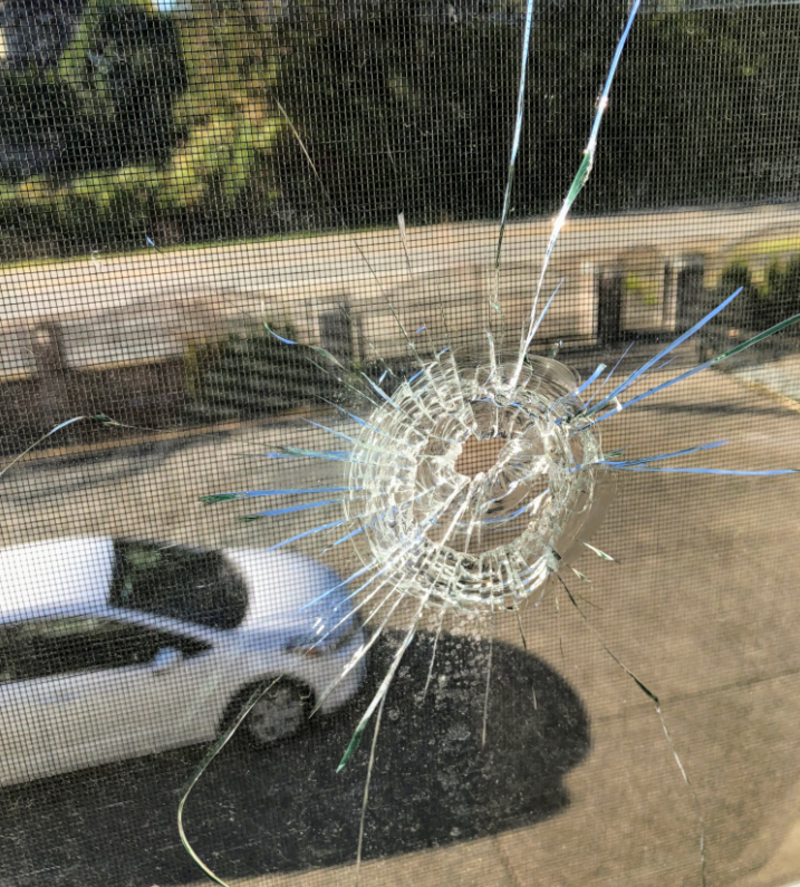 Bullet hole with Stealth Mode in the background. Photo scrubbed of all identifying info.