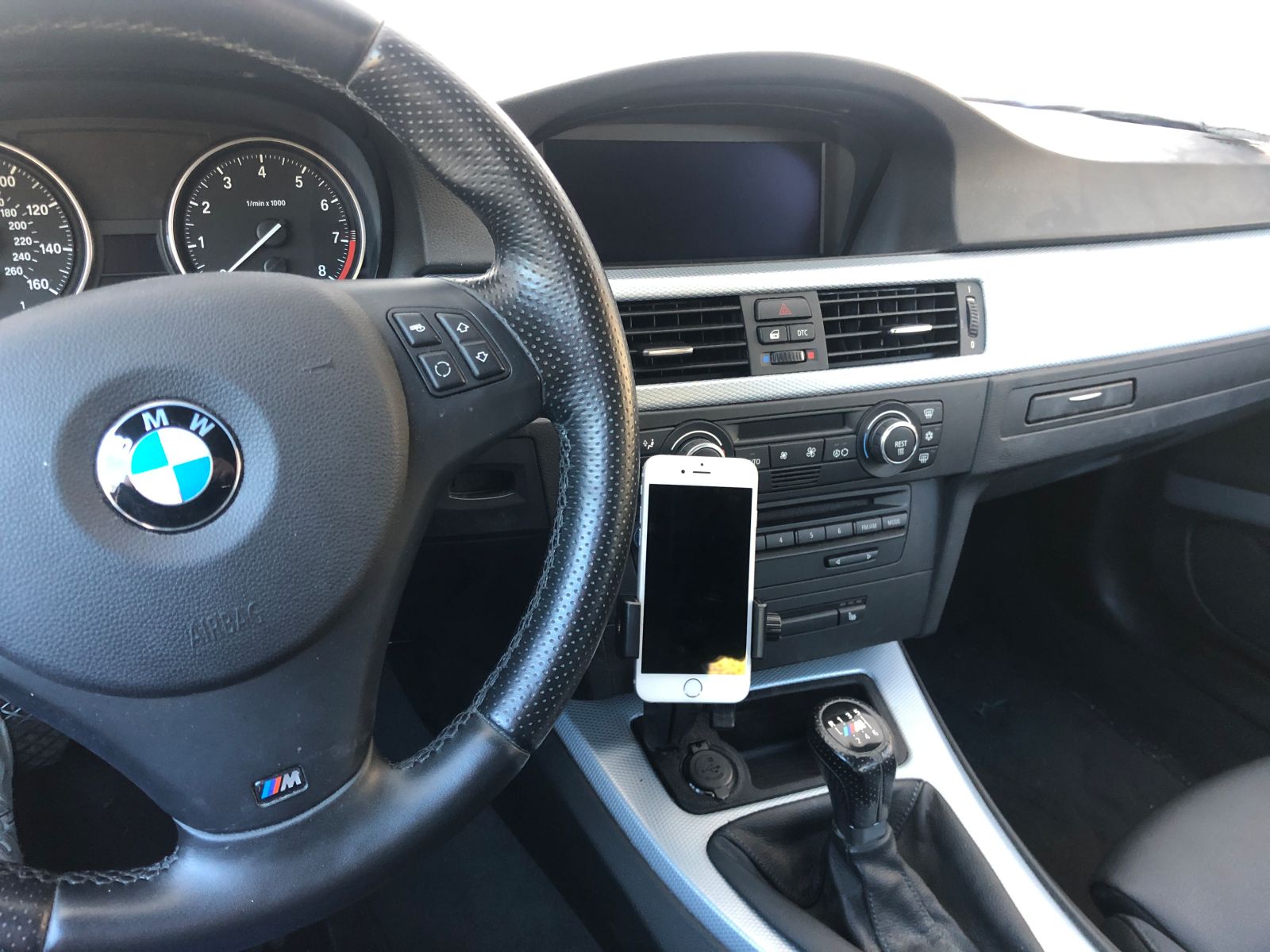 Illustration for article titled Final iteration of the E9X phone holder has been installed into my car