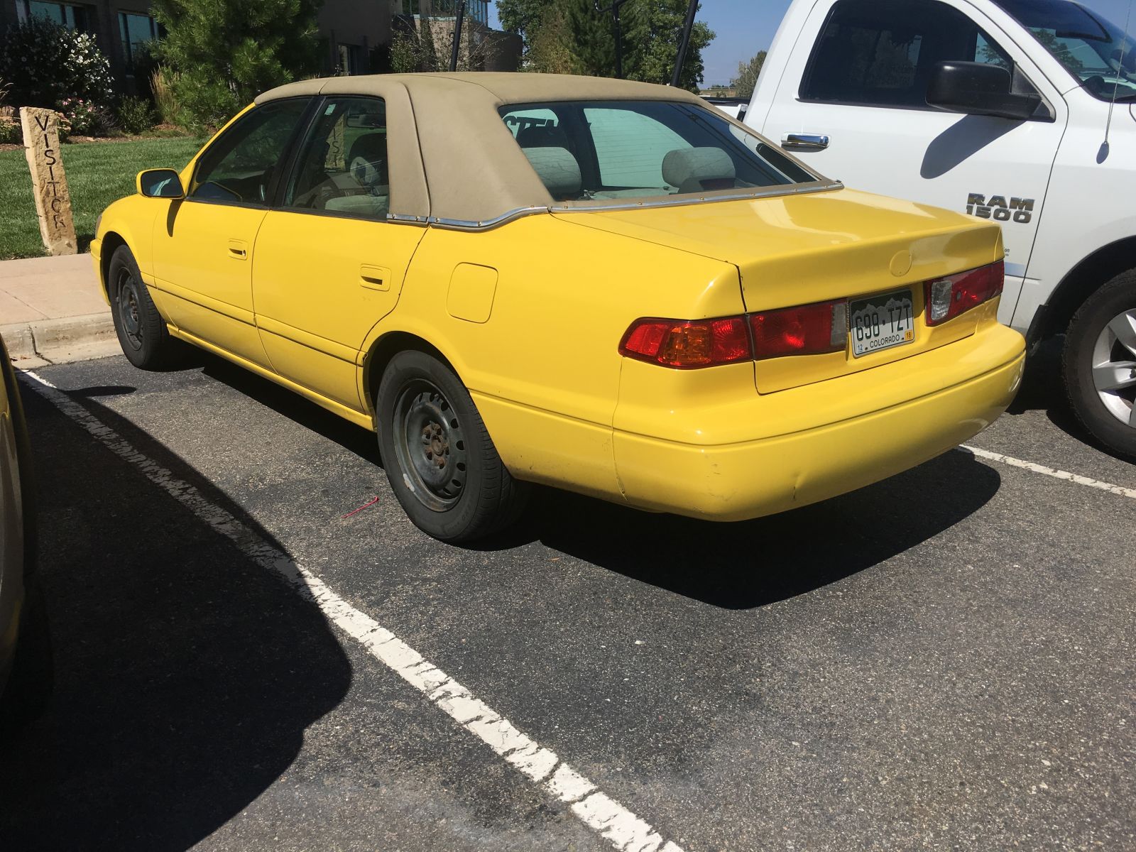 A yellow-resprayed, landau-roofed Camry. Why.