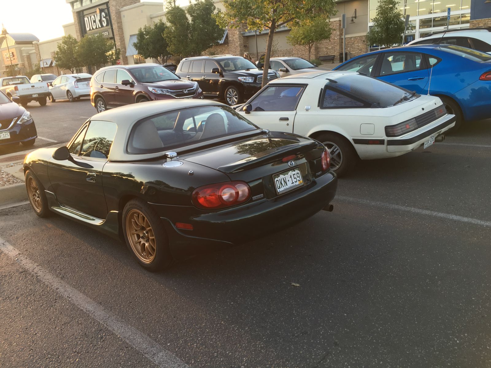 My green &amp; gold Miata found a parking pal at Best Buy.