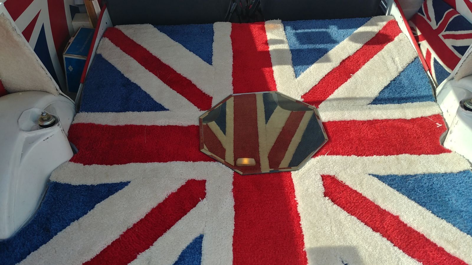 Carpet was furnished in the Union Jack. Look at the mirror, it’s the Union Jack as well.