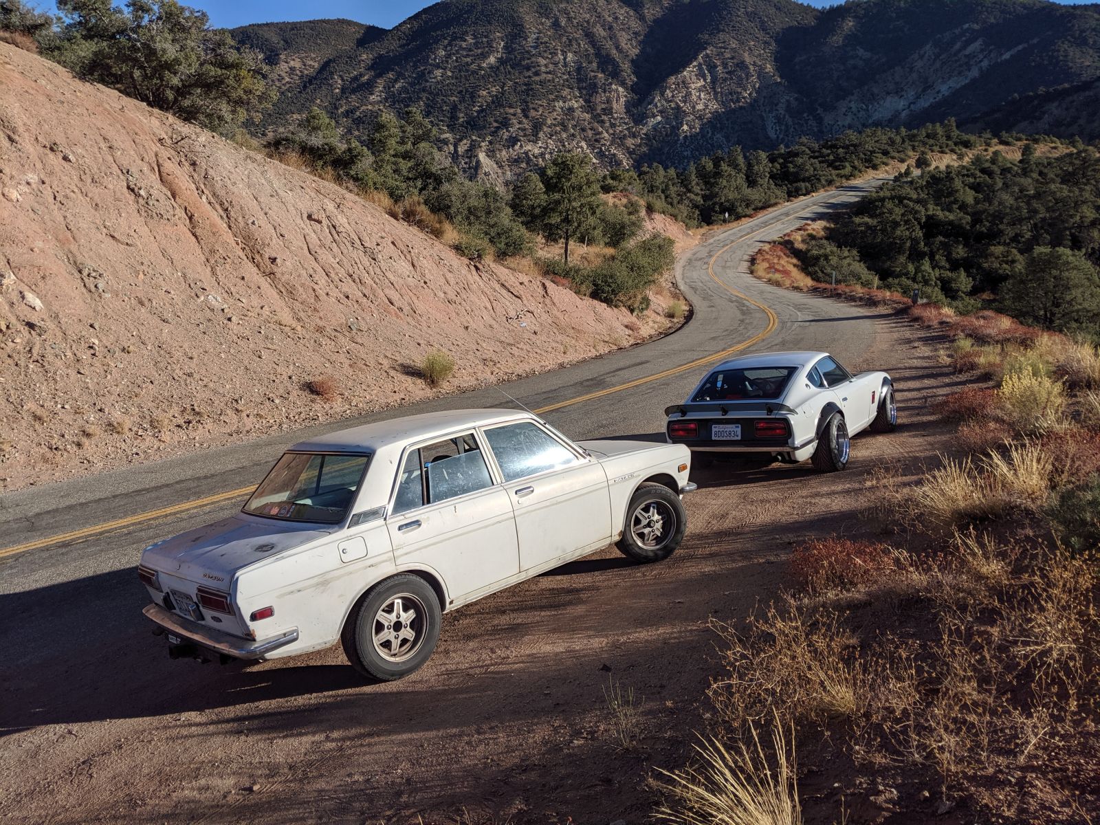 The 510 is a road trip champion with a solid L20 and 5-speed, the Z an LS beast. Climbing to Pinos.