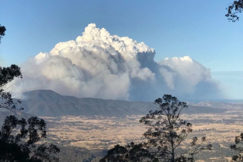 Smoke from a large bushfire burning in the Bega Valley, southeast NSW, Australia 15th August 2018