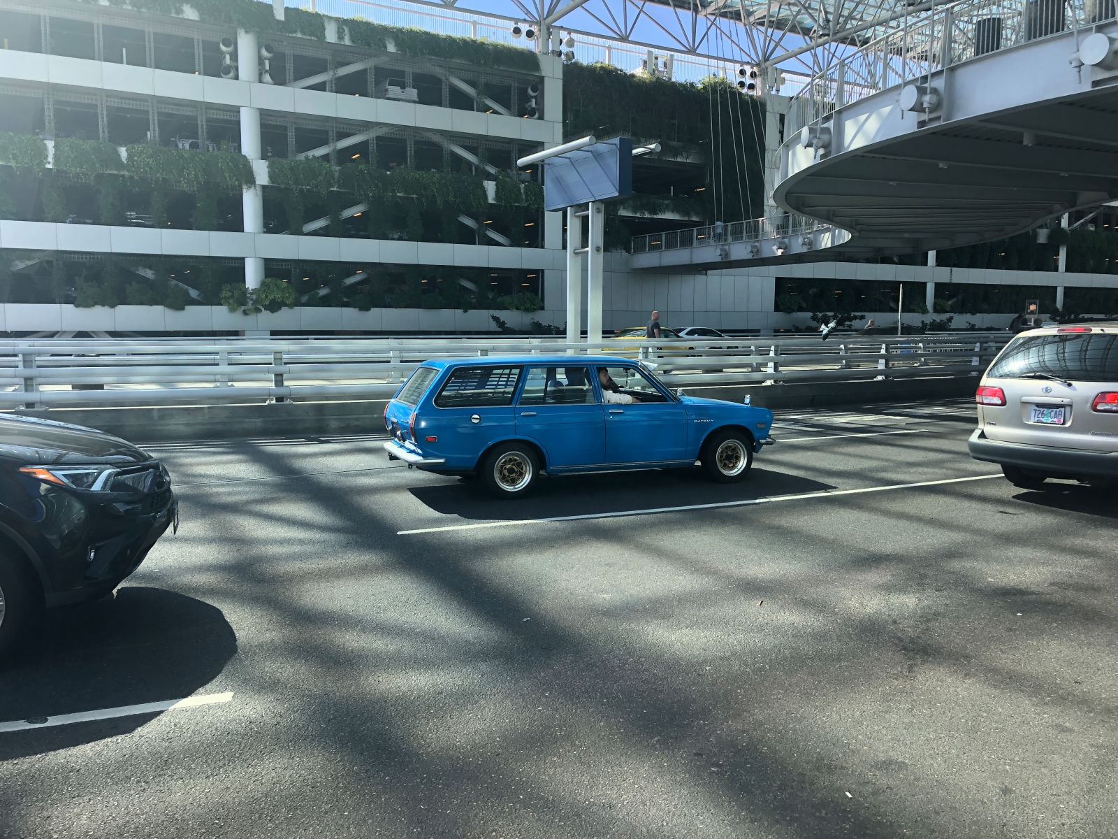Before my ride even turned up at the airport, this awesome Datsun 510 Wagon came by.