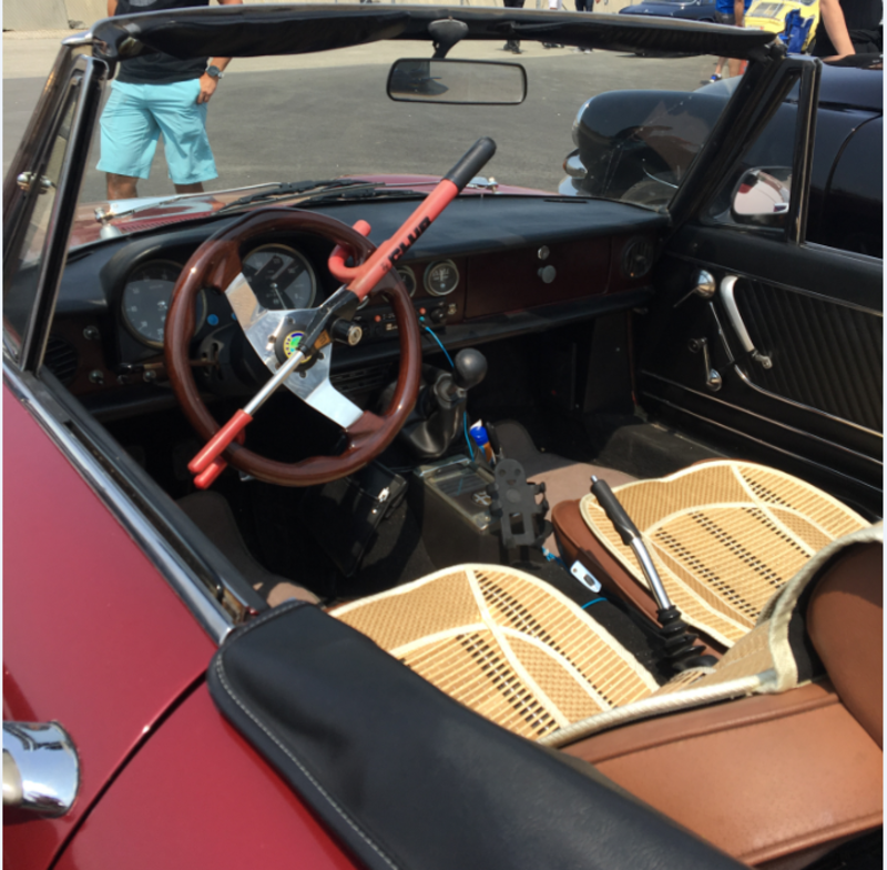 Or you could take this Alfa with these awesome seat covers and a Club. This thing was super rad