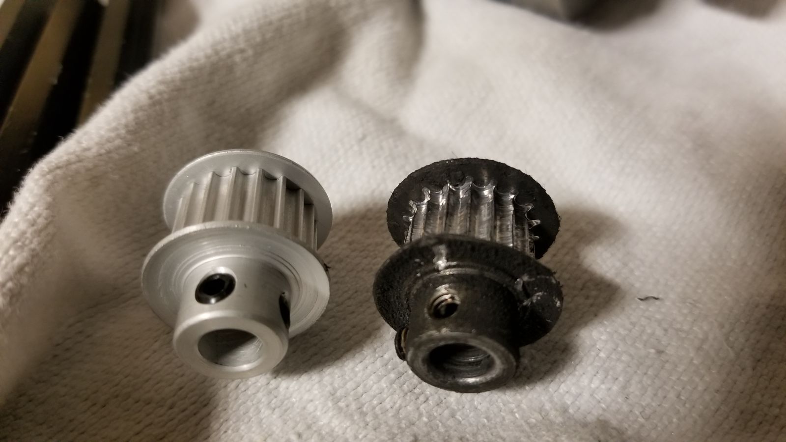 The little guy on the right was way overdue for replacement. You can see how the aluminum wore from where the teeth originally were!!!