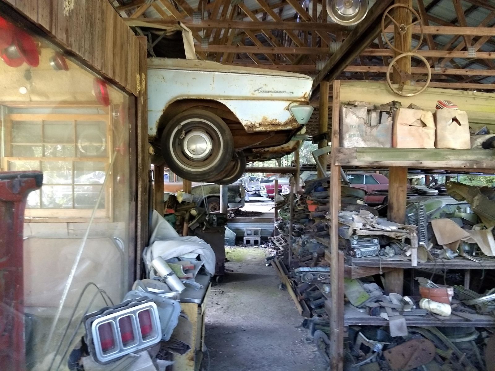 The old office at Old Car City USA. Stacks of car parts are left behind on the shelves from the site’s former career as a junkyard. Of particular interest are the old fashioned AM radios and instrument clusters. 