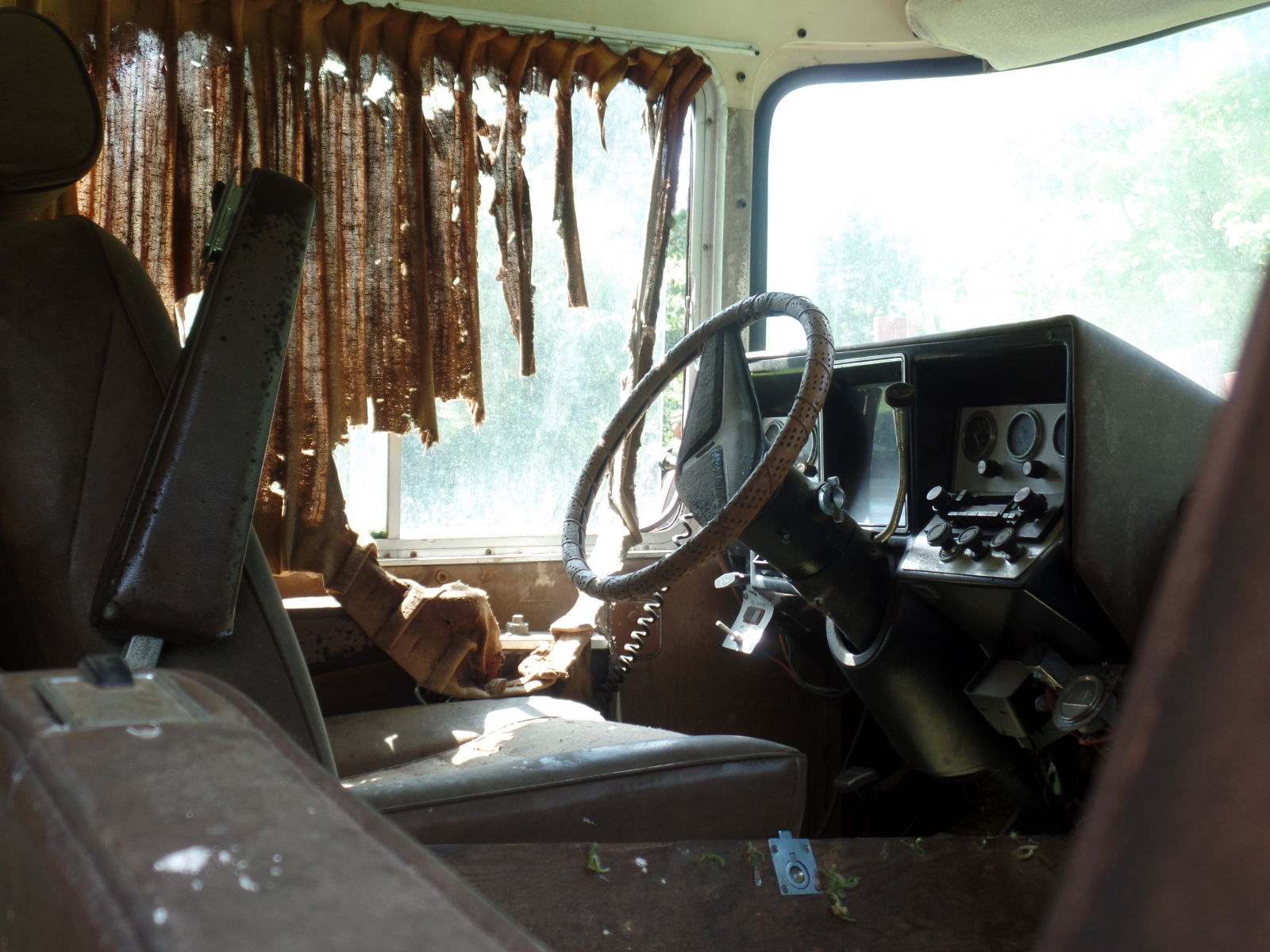 An abandoned RV, complete with pots, pans, and other belongings left behind.