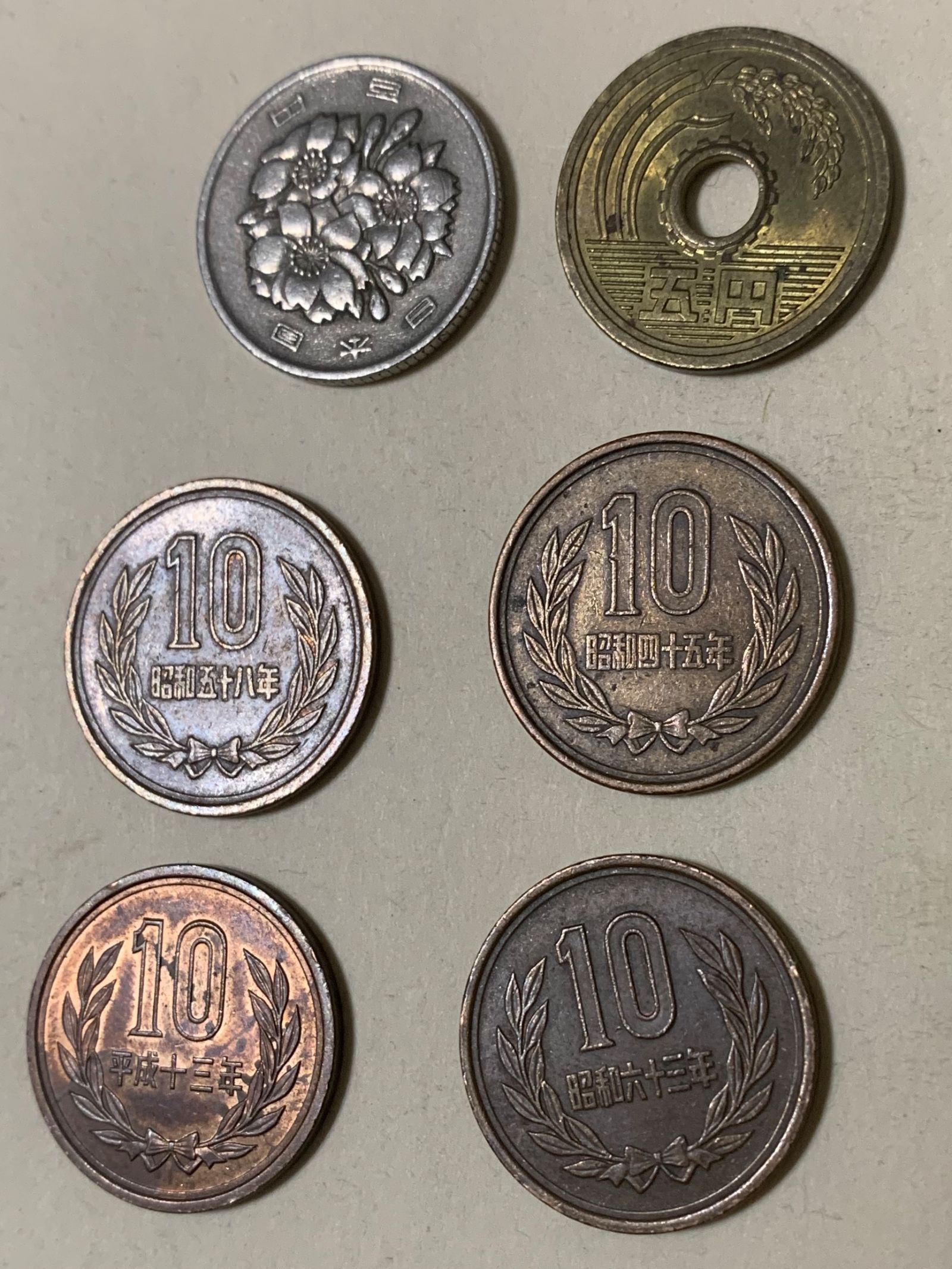 Illustration for article titled Can you tell me anything about these coins? Coworker found them in an old building.