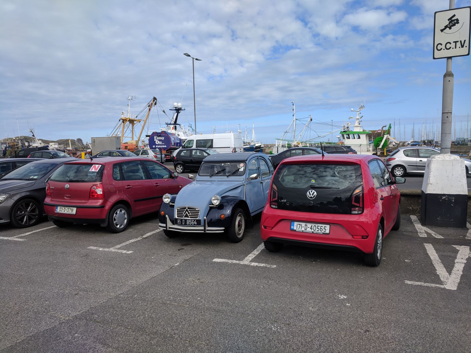 A 2CV and an UP! in a harbor parking lot