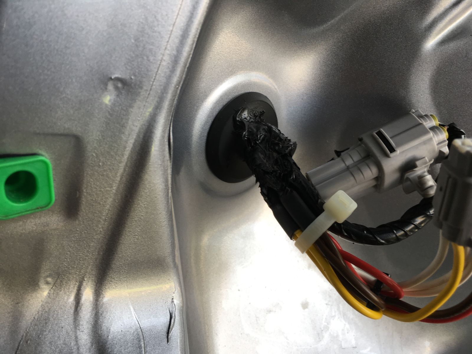 Look at the size of that grey plastic plug connection they wanted me to “squeeze” through the grommet!