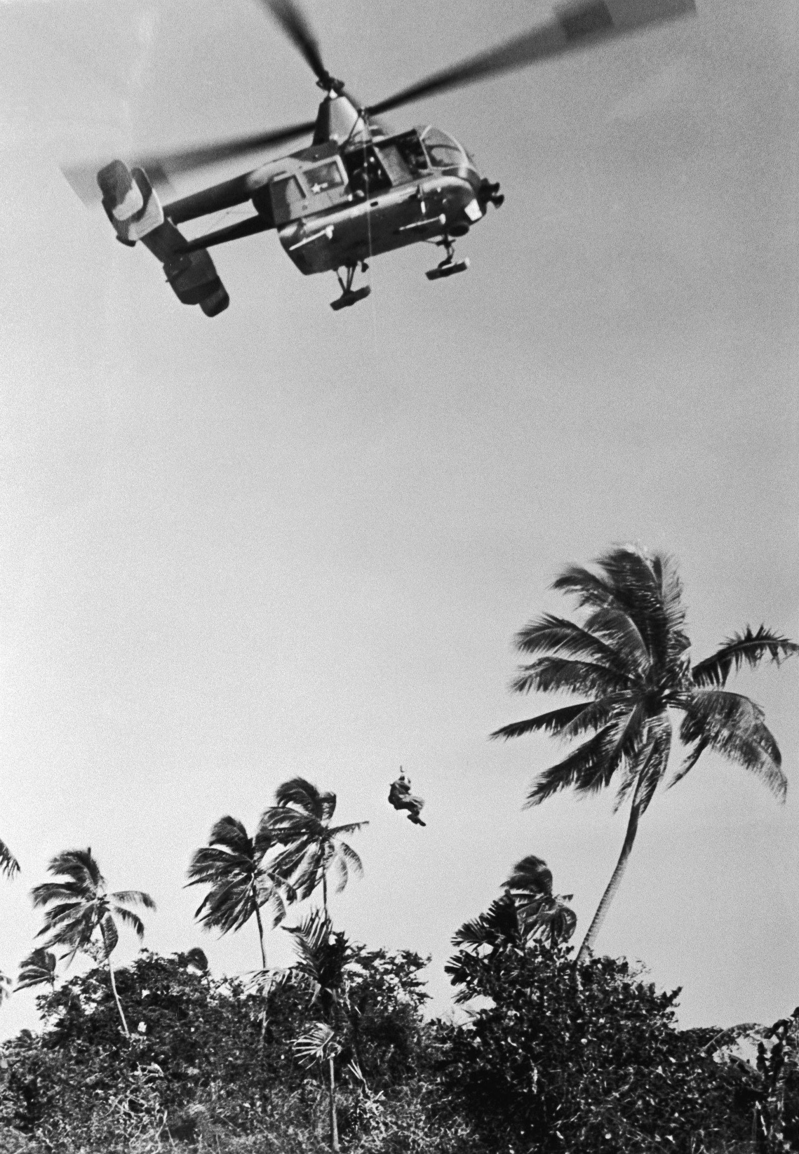 A U.S. Air Force Kaman HH-43B Huskie helicopter is used to rescue a downed airman from the jungles in Southeast Asia, 19 December 1968.