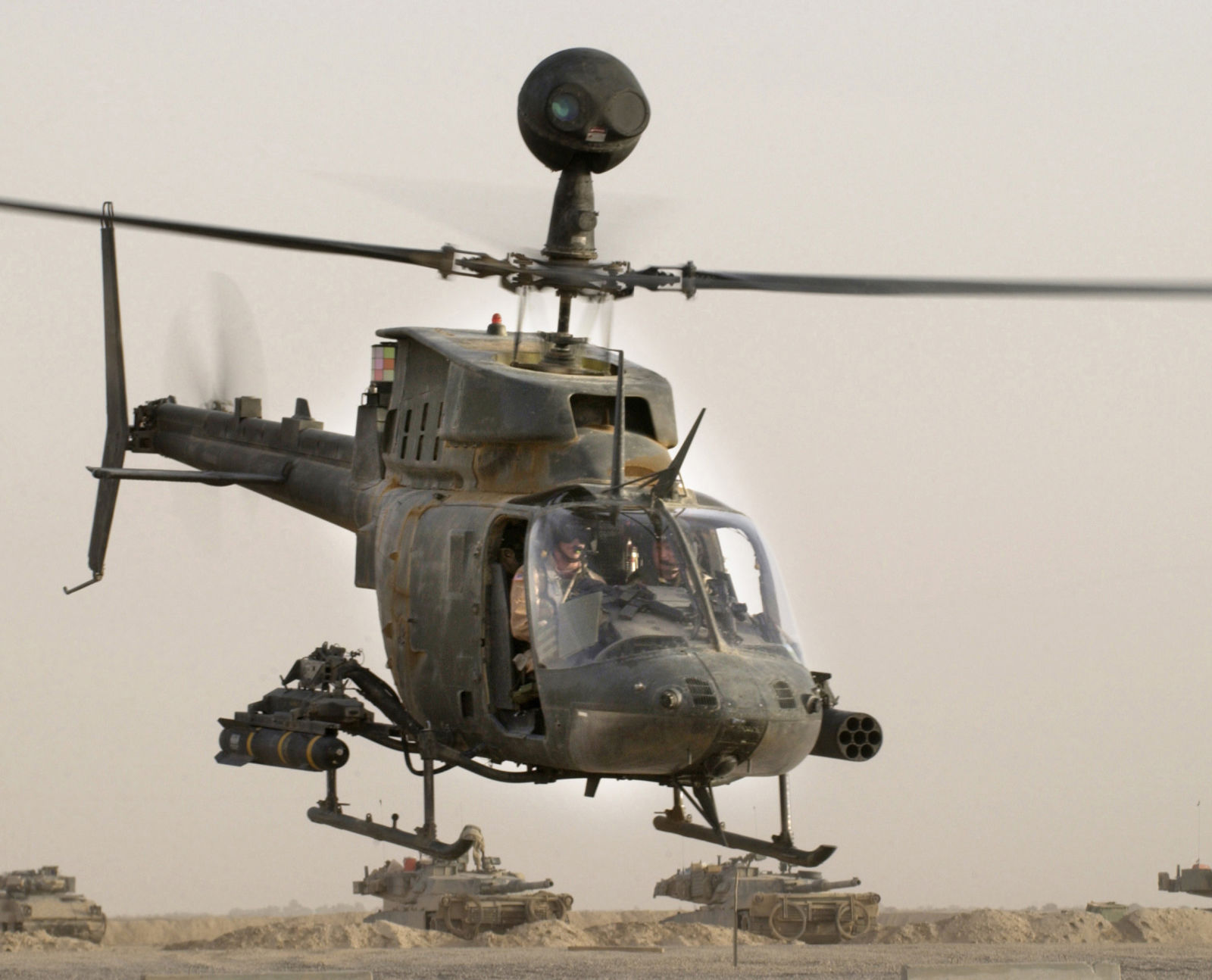 An OH-58D Kiowa Warrior helicopter from the 1st Infantry Division takes off on a mission from Forward Operation Base MacKenzie, Iraq. It is armed with an AGM-114 Hellfire and 7 Hydra 70 rockets.