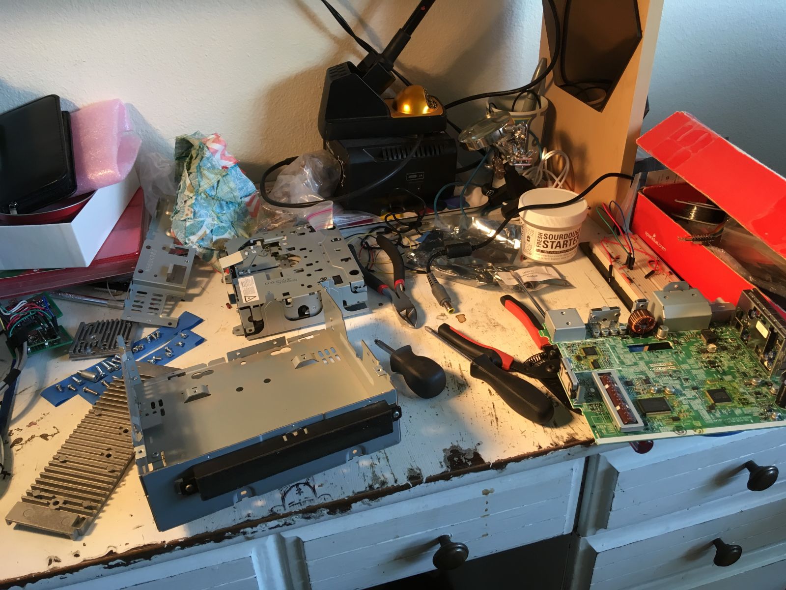 Various parts of the stereo system strewn about my work desk