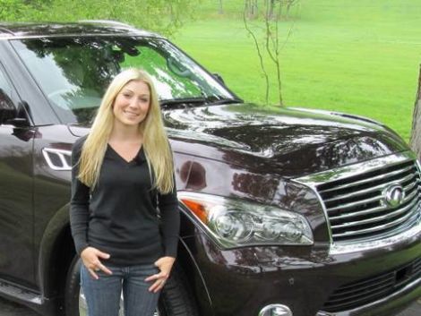 Ms. Watkins poses in front of her Infiniti QXYZ8056