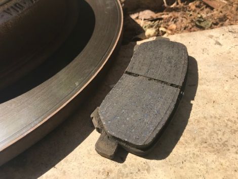 One of the old rotors and pads had matching divots in them. 