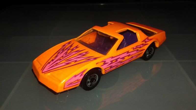 Hot Wheels - blindingly vibrant Pontiac Firebird with orange paint and pink lightning! :D