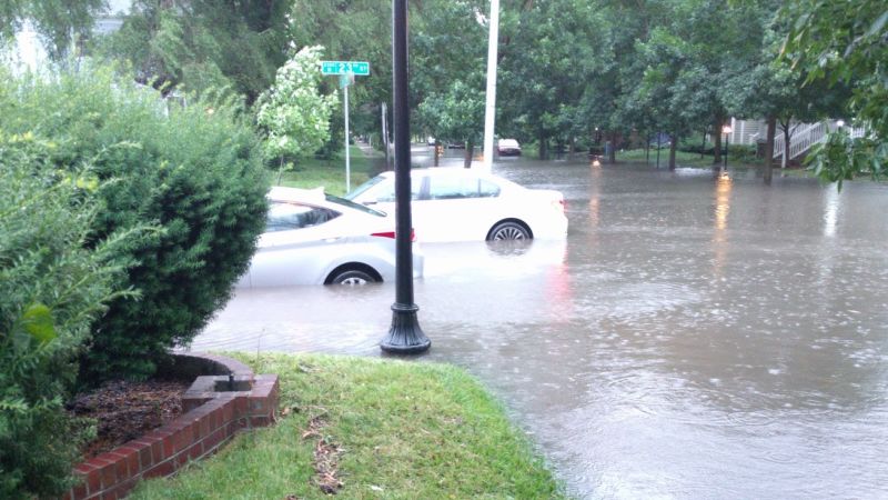 The view of that flood from my front porch. That white car was a brand new 7 Series, still wearing temporary tags.