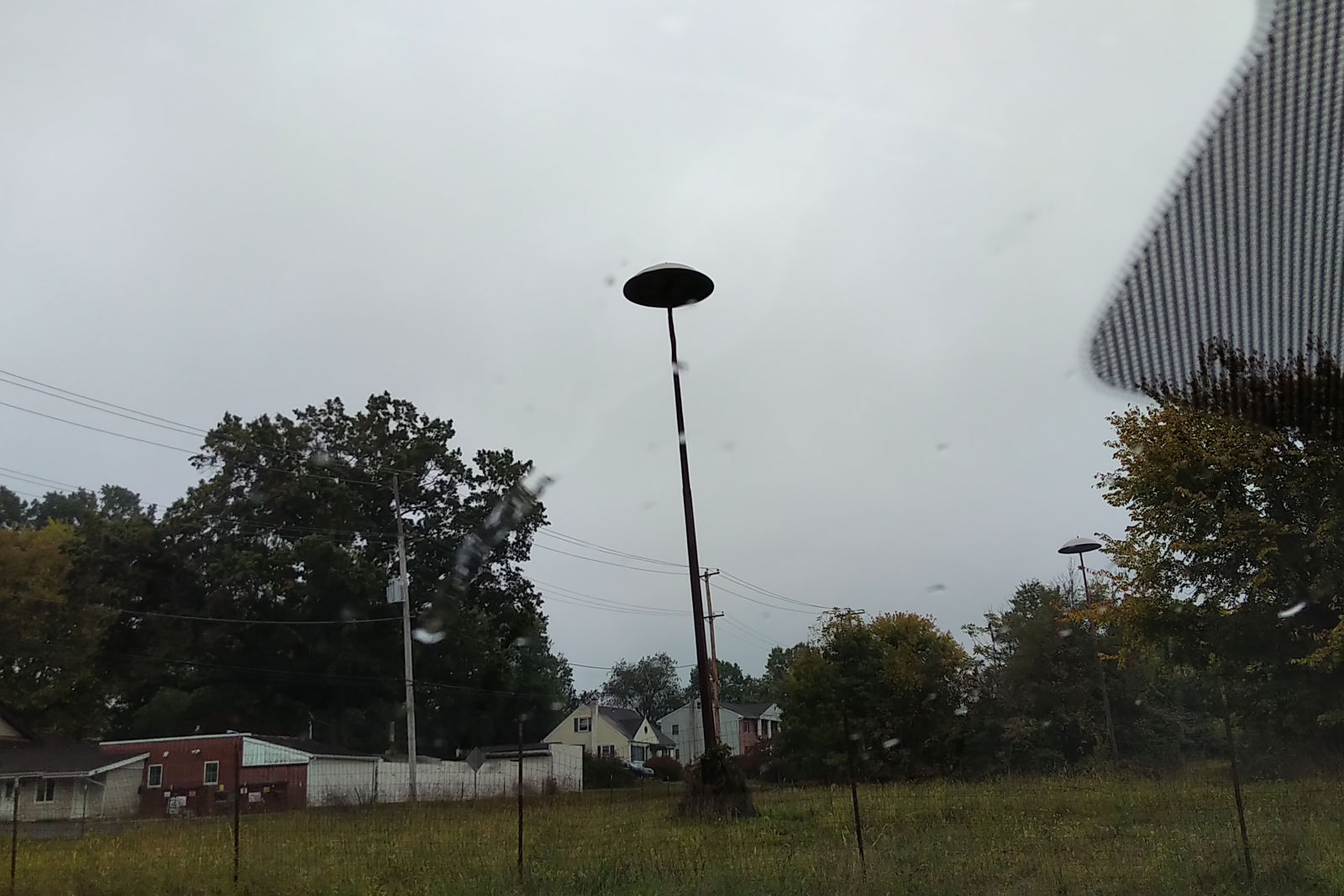 There’s a few of these flying saucer-like light poles still standing in the overgrown parking lot