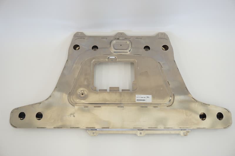 OEM aluminum subframe reinforcement plate - note the un-crushed condition of the oval-like bump at top-center. I’m an idiot.