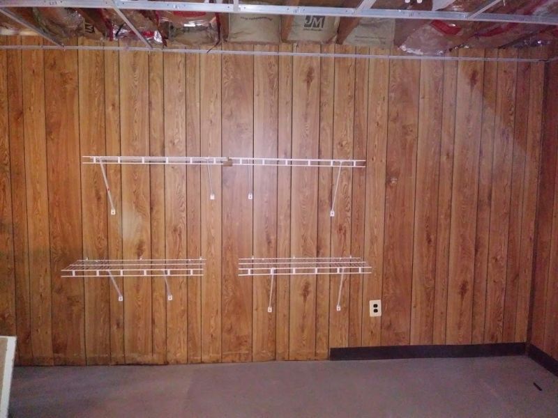 You can see some water damage to the bottom of the panelling where the toe board was hiding it behind all the scrap wood the house came with