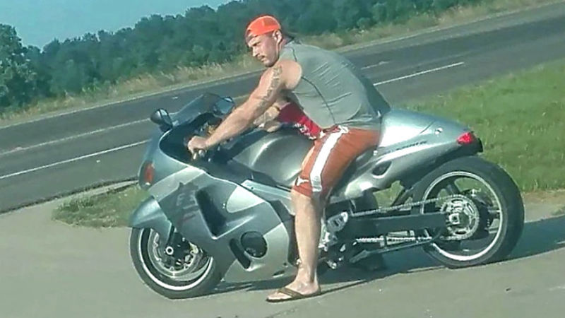 Illustration for article titled A guy in Texas has been arrested after giving his baby a ride on the gas tank of his Suzuki Hayabusa