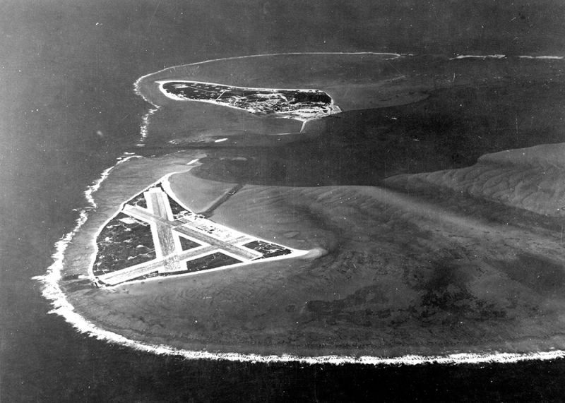 The Midway Atoll, looking westward. Eastern Island, with the airfield, is in the foreground, with Sand Island behind. (US Navy)