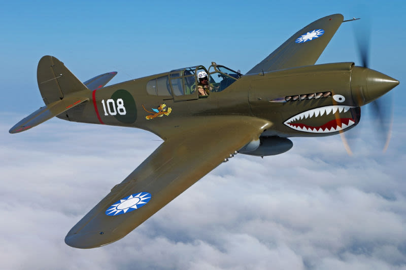 A vintage P-40 warbird in American Volunteer Group (Flying Tigers) livery. The roundels on the wing represent Nationalist China. (Military Aviation Museum)