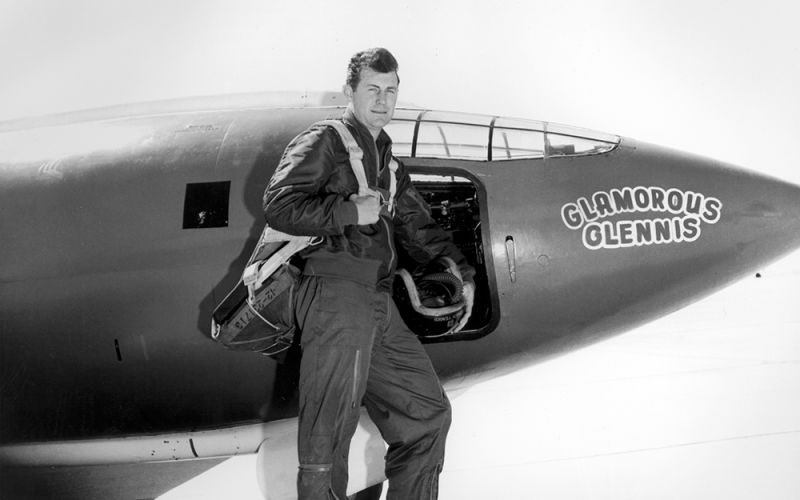 Chuck Yeager stands outside the X-1, named Glamorous Glennis after his wife. The first two X-1s were painted saffron (yellow-orange) to make them easier to see in flight. The second X-1 was then repainted white, along with the third and all subsequent X planes. (NASA)