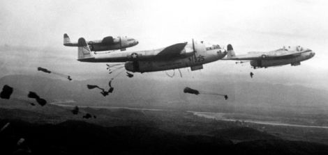 Paratroopers of the 187th Airborne Regimental Combat Team jump out of US. Air Force C-119 Flying Boxcars over Korea in 1950. (US Air Force)