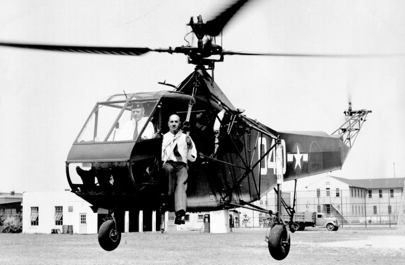 The XR-4 is evaluated by the US Coast Guard, with Igor Sikorsky seated in the hoist sling. (US Coast Guard)