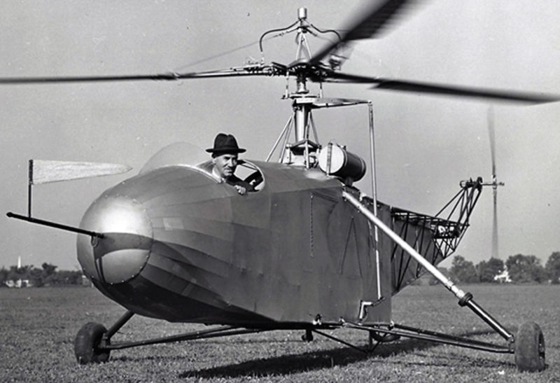  Igor Sikorsky, wearing his trademark fedora, at the controls of the VS-300. The VS-300 formed the basis for the V-316 and R-4. (Sikorsky Archives)