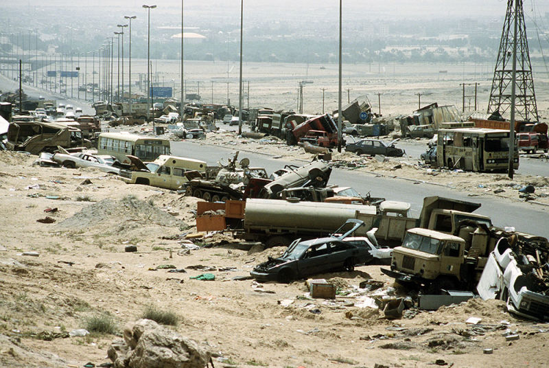 Destroyed and abandoned vehicles litter Highway 80, known as the Highway of Death, after retreating Iraqi soldiers were attacked by Coalition aircraft at the close of the battle (US Air Force)