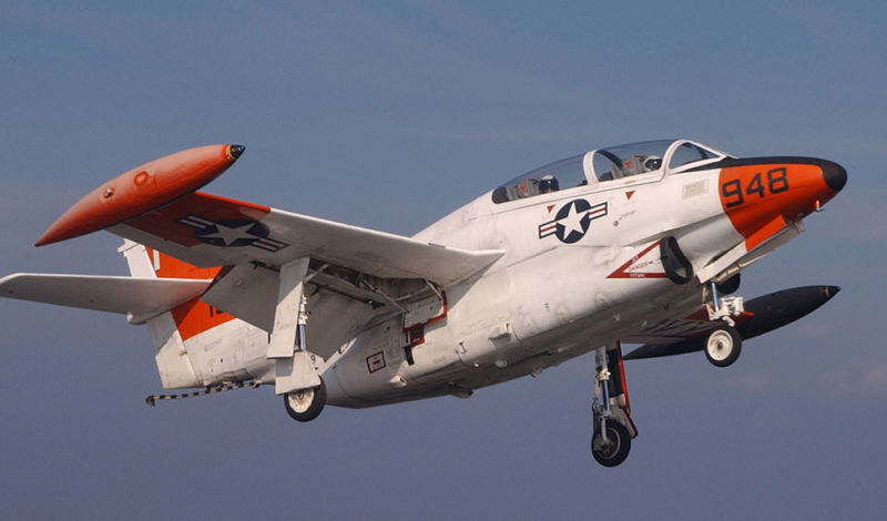 A T-2C Buckeye assigned to Fixed Wing Training Squadron Nine (VT-9) performs a touch and go on the flight deck of USS Harry S. Truman (CVN 75) in 2003 (US Navy)