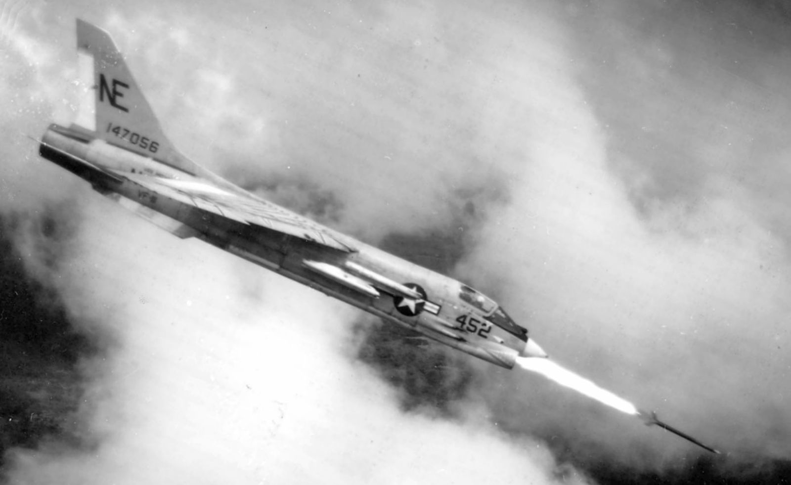 A US Navy F-8D Crusader of Fighter Squadron VF-111 “Sundowners” fires a Zuni rocket over South Vietnam in 1965. (US Navy)