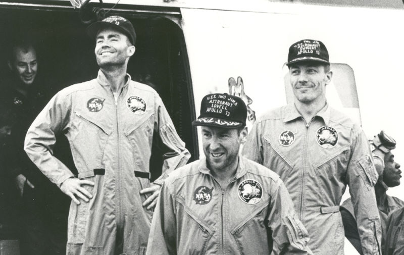 Haise, Lovell and Swigert exit a helicopter aboard USS Iwo Jima (LPH 2) following splashdown in the Pacific Ocean (NASA)