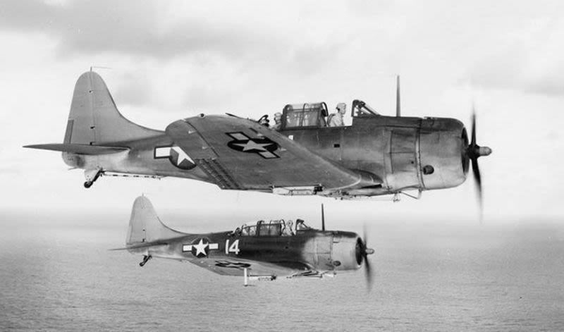 Two US  Navy Douglas SBD-5 Dauntless dive bombers from bombing squadron VB-5 return to the aircraft carrier USS Yorktown (CV-10) after the attack on Wake Island, October 5, 1943. (US Navy)