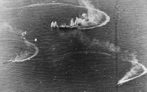 The Japanese aircraft carrier Zuikaku (center) and the destroyers Akizuki and Wakatsuki under attack from US Navy carrier aircraft. Zuikaku was hit by several bombs during these attacks, but survived. (US Navy)